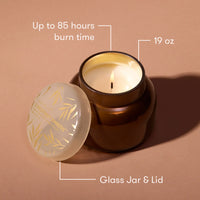Chestnut Embers Autumn Glow Signature Jar Candle with floral design and 85-hour burn time