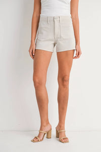 Beige high-rise patch pocket denim short displayed in HIGH RISE PATCH POCKET DENIM SHORT