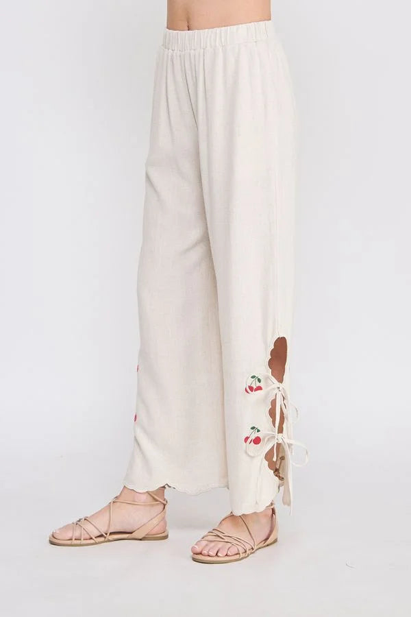 Beige linen elastic waist embroidered pants with cherry-themed cutouts
