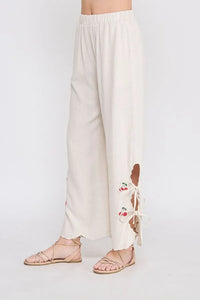 Beige linen elastic waist embroidered pants with cherry-themed cutouts