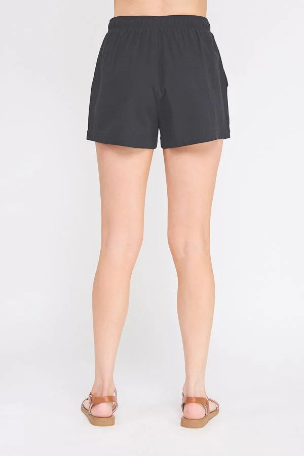 Black woven elastic tie-waist shorts from Shop Daisy, ideal for women’s boho chic clothing