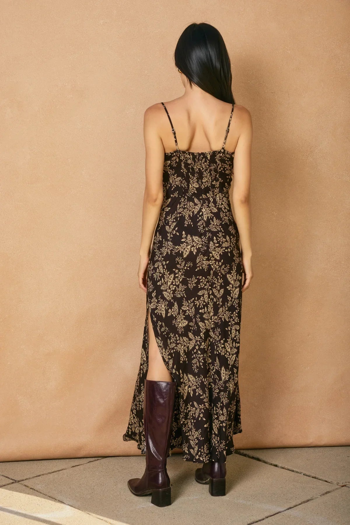 Black floral tie slit maxi dress with spaghetti straps and burgundy block-heel boots