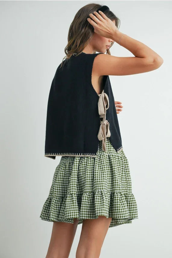 Black and green gingham ruffled mini skirt with mock neck sleeveless sweater