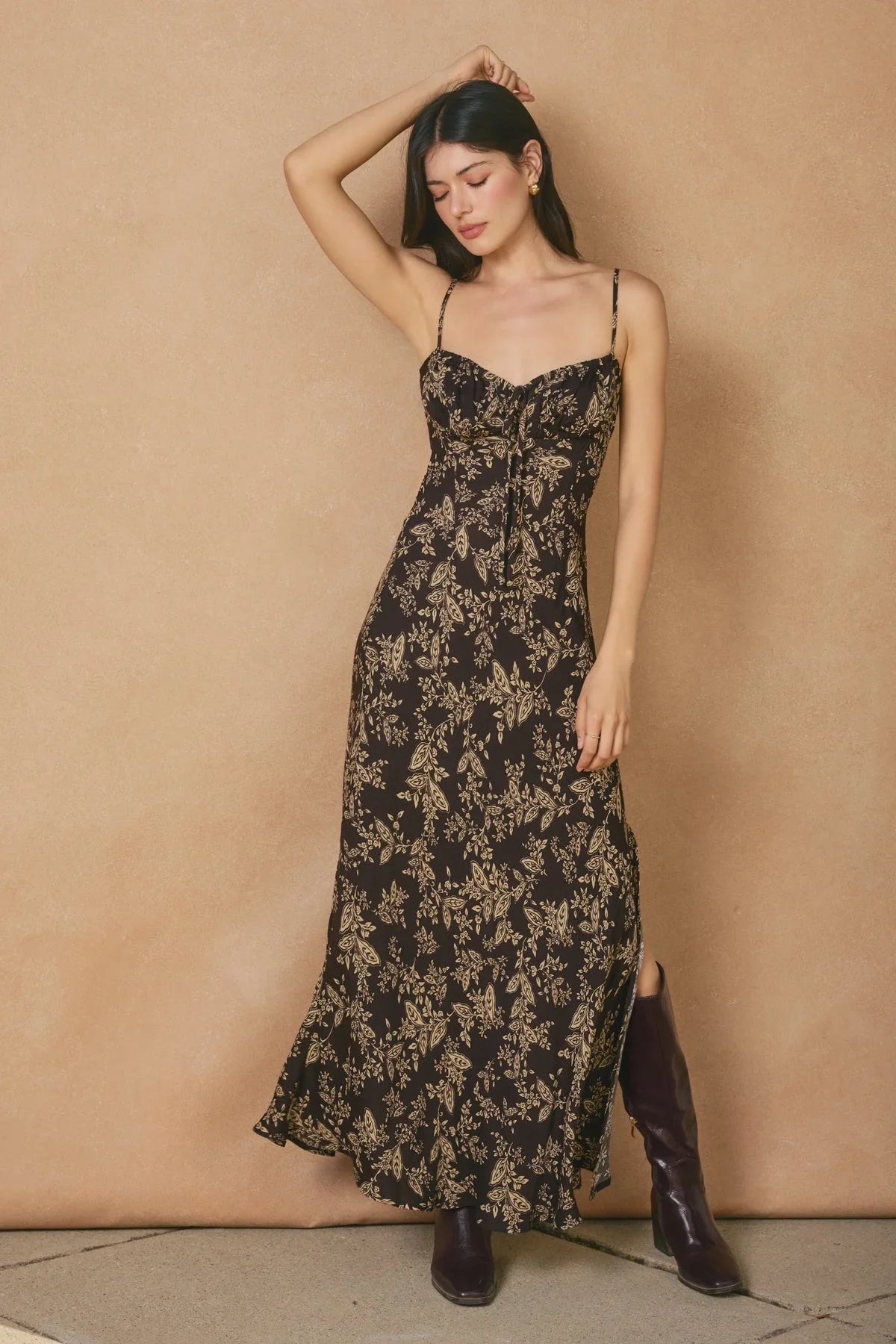 Black tie slit maxi dress with thin straps and light botanical print for elegant style