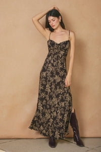 Black tie slit maxi dress with thin straps and light botanical print for elegant style