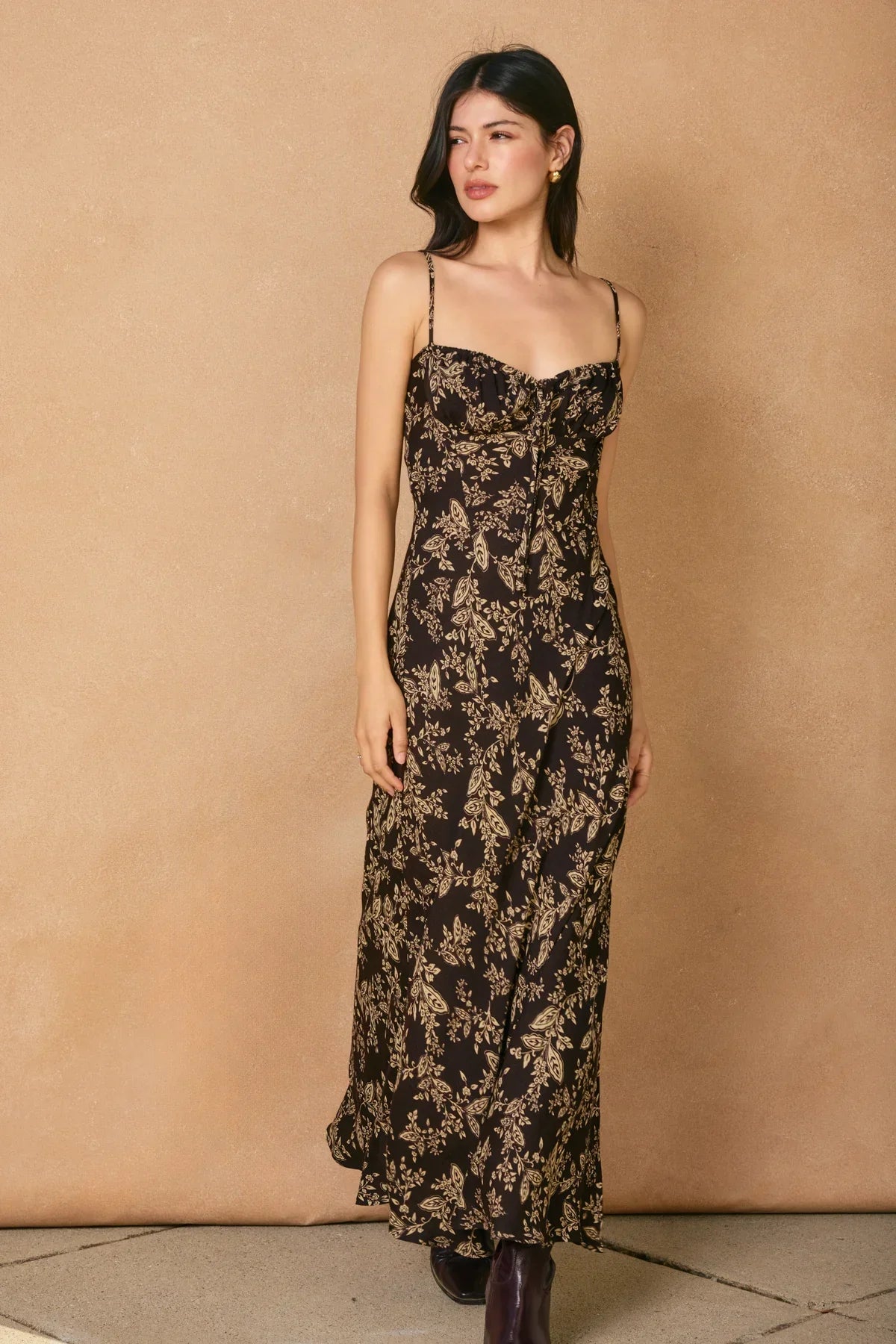 Black tie slit maxi dress with gold floral print and spaghetti straps for elegant style
