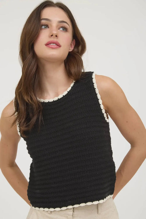 Black textured crochet knit sleeveless tank top with cream trim for stylish summer wear