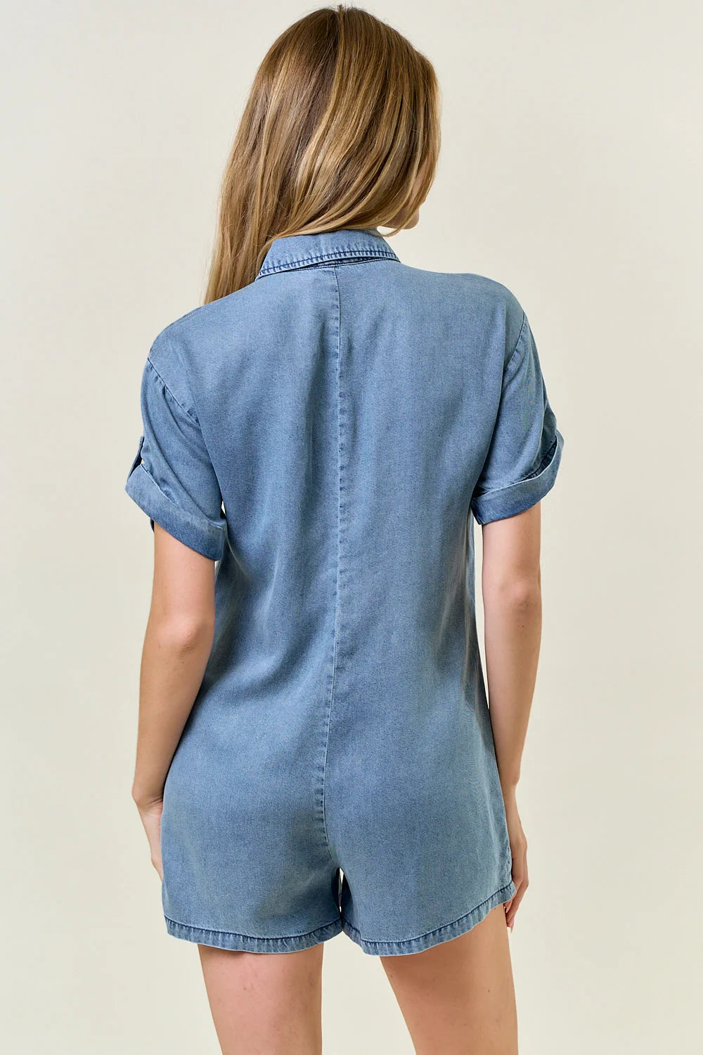 Blue denim romper made from TENCEL denim, perfect for women’s boho chic clothing from Shop Daisy