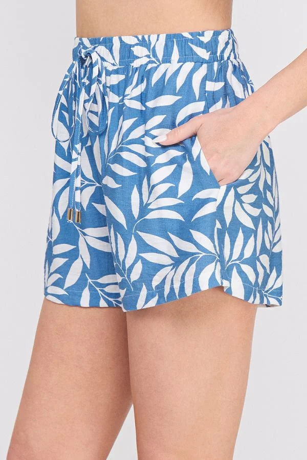Blue and white leaf-patterned printed woven tie shorts for a stylish look