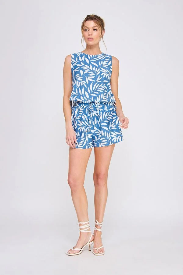 Blue and white leaf-patterned printed woven tie shorts for stylish summer wear