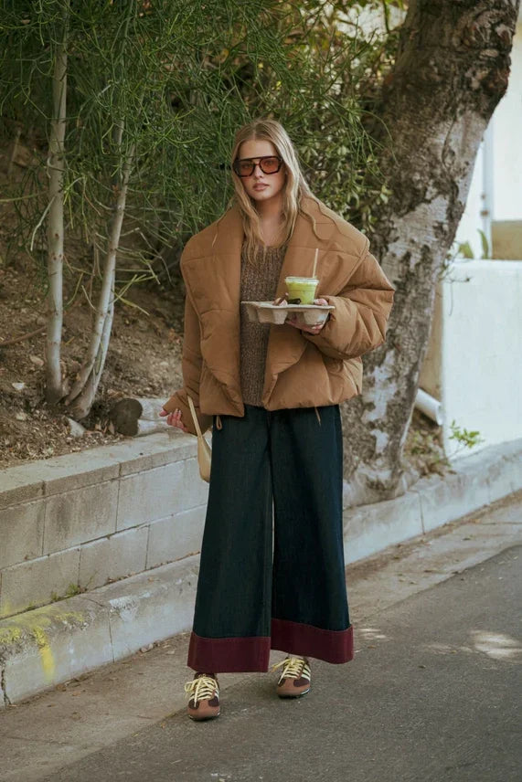Brown suede jacket with wide-leg contrasted cuffed pants and sunglasses for a stylish look