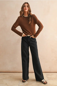 Women’s long sleeve layered knitted top with brown sweater and black wide-leg pants