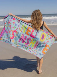 Colorful Hello Sunshine beach towel from Jacksonville Beach, perfect for microfiber yoga