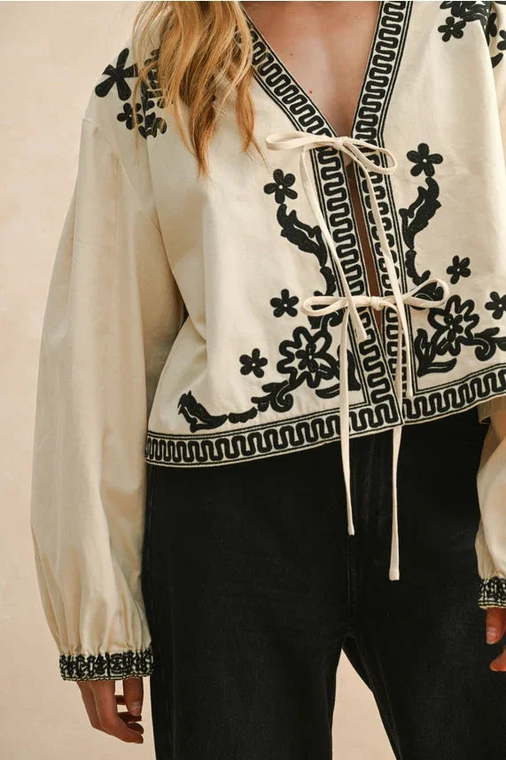 Cream and black floral patch detailed jacket with lace-up front