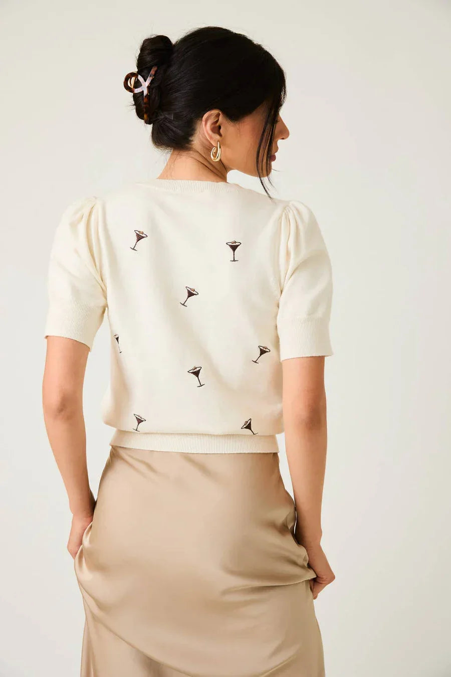 Cream-colored puff sleeve embroidered knit top with martini glass design for elegant style