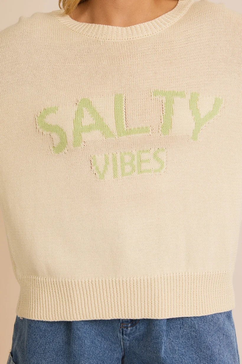 Cream-colored cropped sweater with SALTY VIBES text in light green, light weight sweater