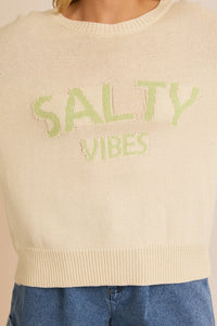 Cream-colored cropped sweater with SALTY VIBES text in light green, light weight sweater