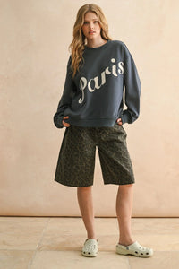 Dark gray Paris Patch sweatshirt with white script, ideal for women’s boho chic clothing from Shop Daisy