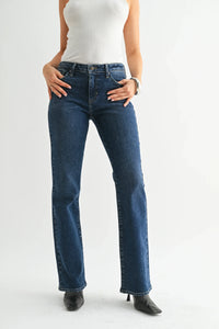 Dark wash low rise vintage slim bootcut denim jeans with white tank top and black heels