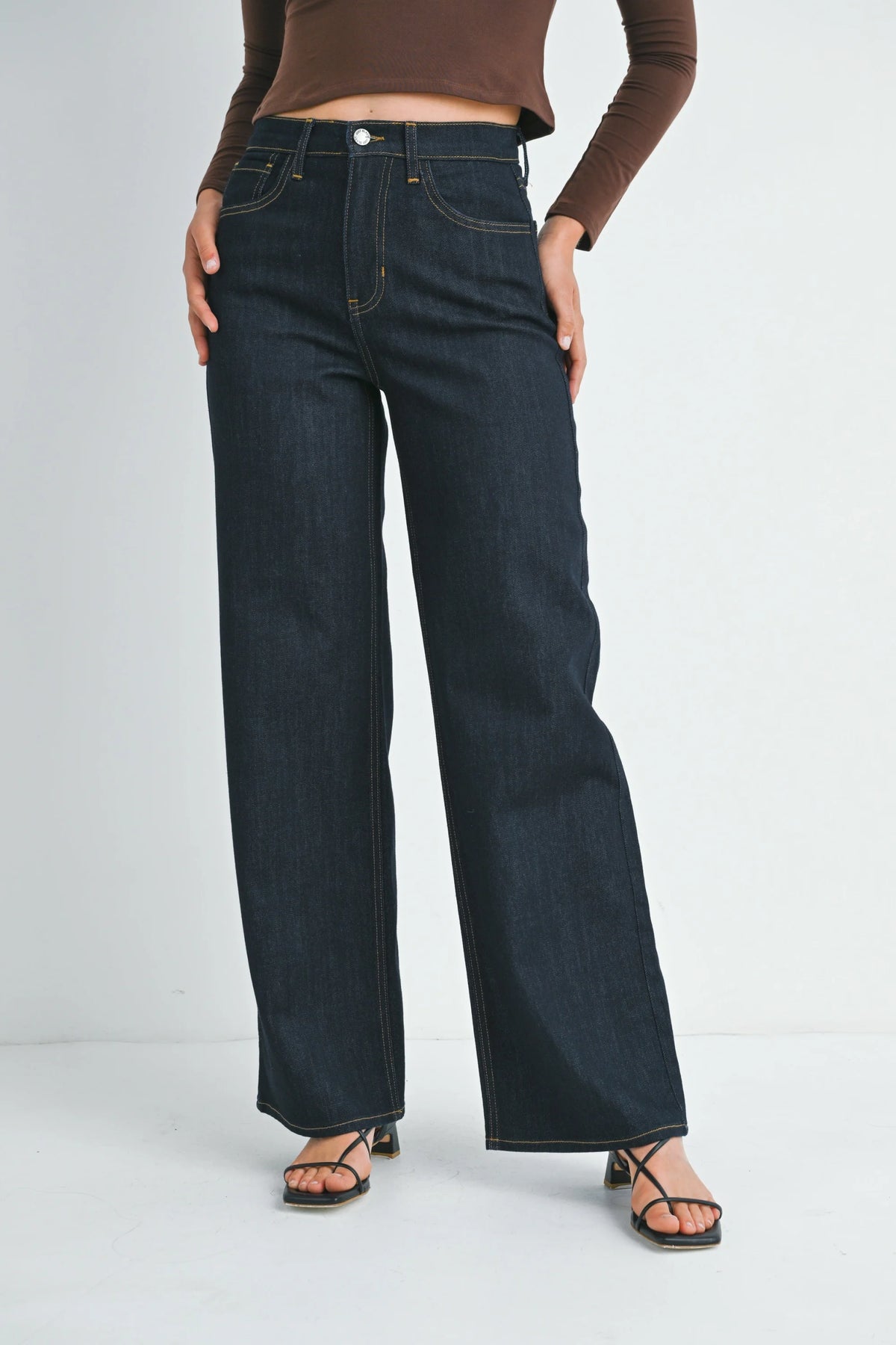 Dark wash high-rise relaxed wide leg denim jeans with contrast white stitching