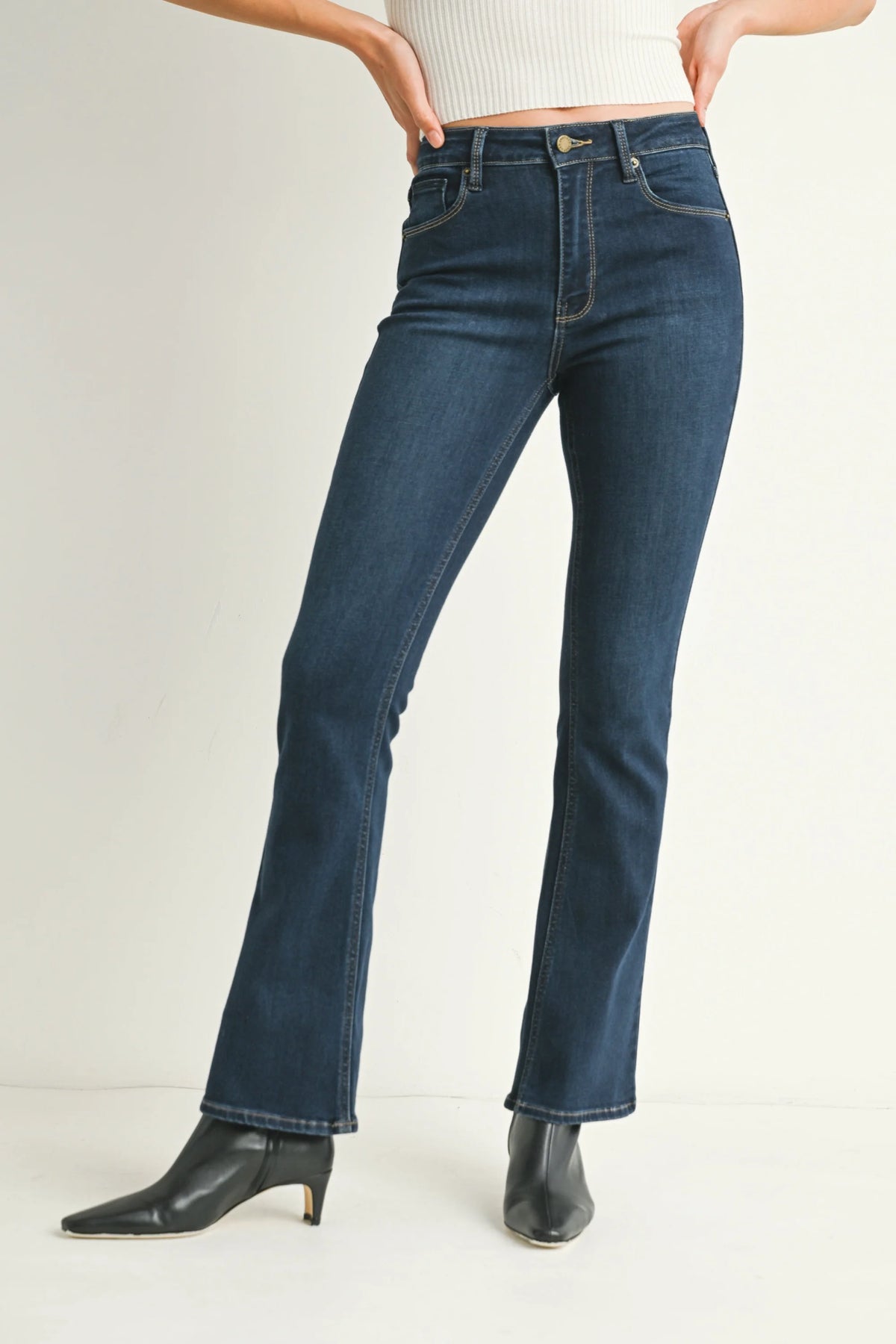 Dark wash mid rise flare slim bootcut denim jeans with gold button closure