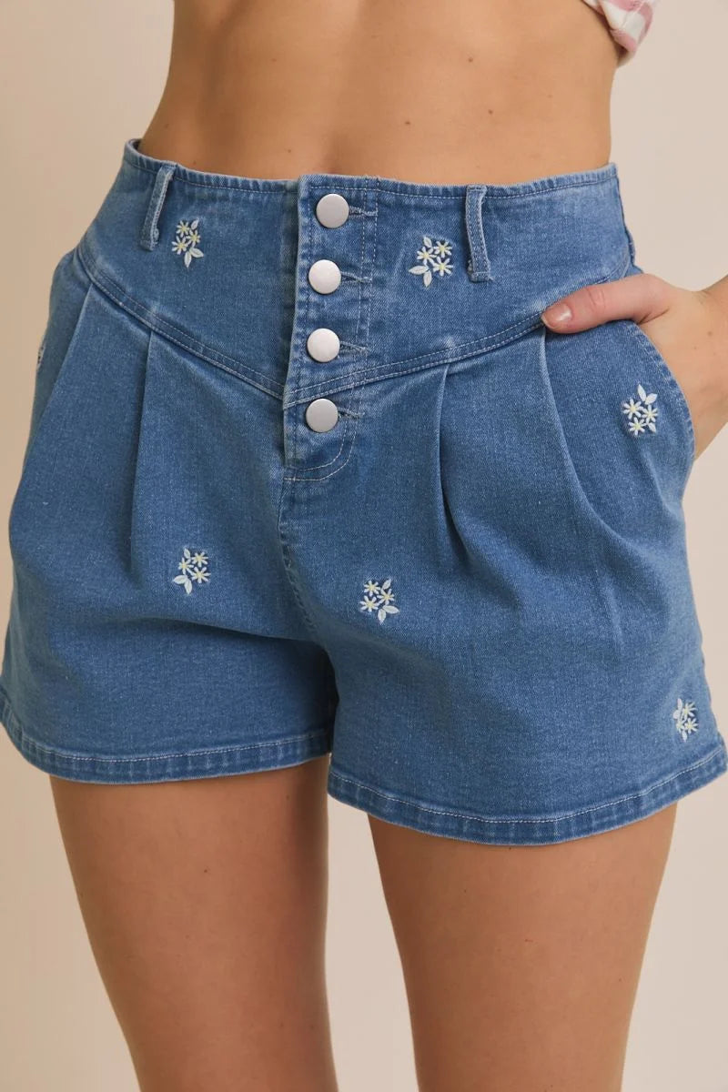 Blue denim shorts with floral embroidered pleated design for stylish casual wear
