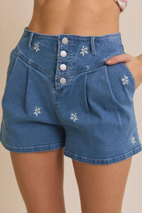 Blue denim shorts with floral embroidered pleated design for stylish casual wear