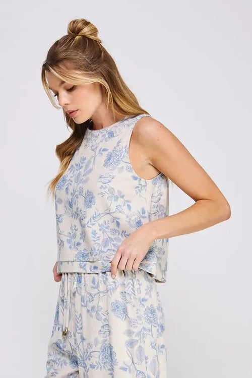 Floral-patterned sleeveless tank top with layered hem, ideal for womenās boho chic clothing from Shop Daisy