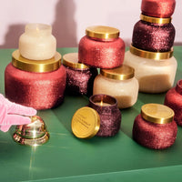 Gold bell with red glitter jar candle from TINSEL & SPICE GLAM PETITE CANDLE set