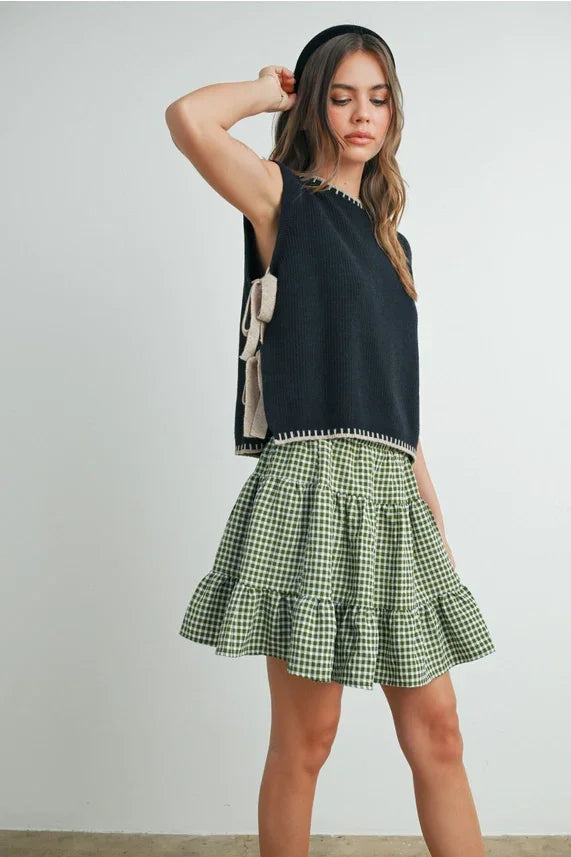 Mock neck sleeveless sweater with green gingham ruffled skirt