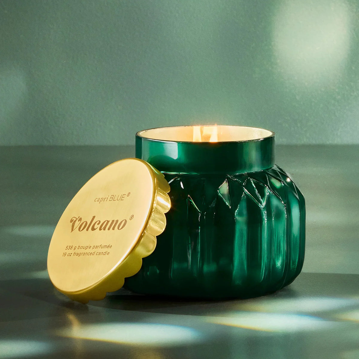 Green glass Royal Gem Volcano candle with gold lid from Capri Blue Signature Royal Gem collection