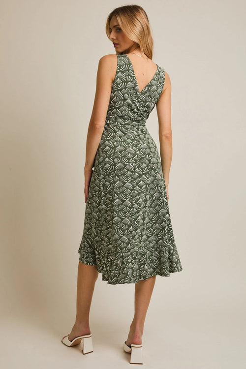 Green V-neck sleeveless midi dress with waist tie, shell pattern, and ruffled hem