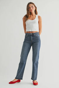 High-waisted full length straight denim jeans in medium wash with red ballet flats and white crop top