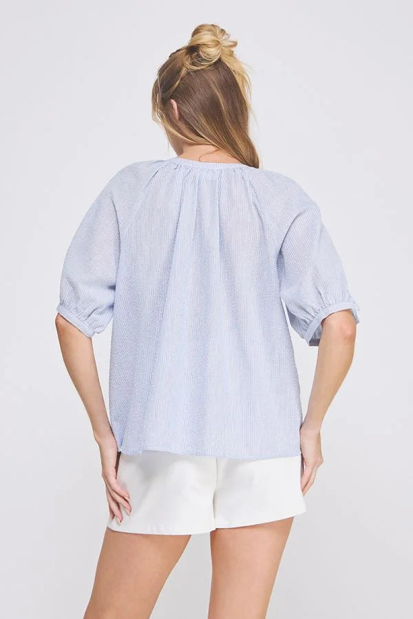 Light blue striped seersucker blouse with white shorts from Daisy Lane’s Striped Seersucker collection