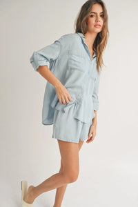 Light blue denim shirt and shorts set from Shop Daisy, perfect for women’s boho chic clothing
