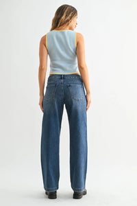 Light blue sleeveless top with yellow trim paired with mid rise slim wide leg sweat denim jeans