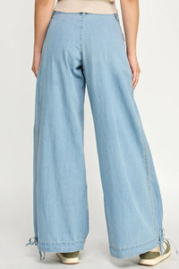 Light blue wide-leg denim pants from LOTUS STRETCH JEANS, perfect for women’s boho chic clothing