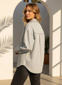 Light gray long-sleeved supply Etta shirt with visible stitching and rounded hem