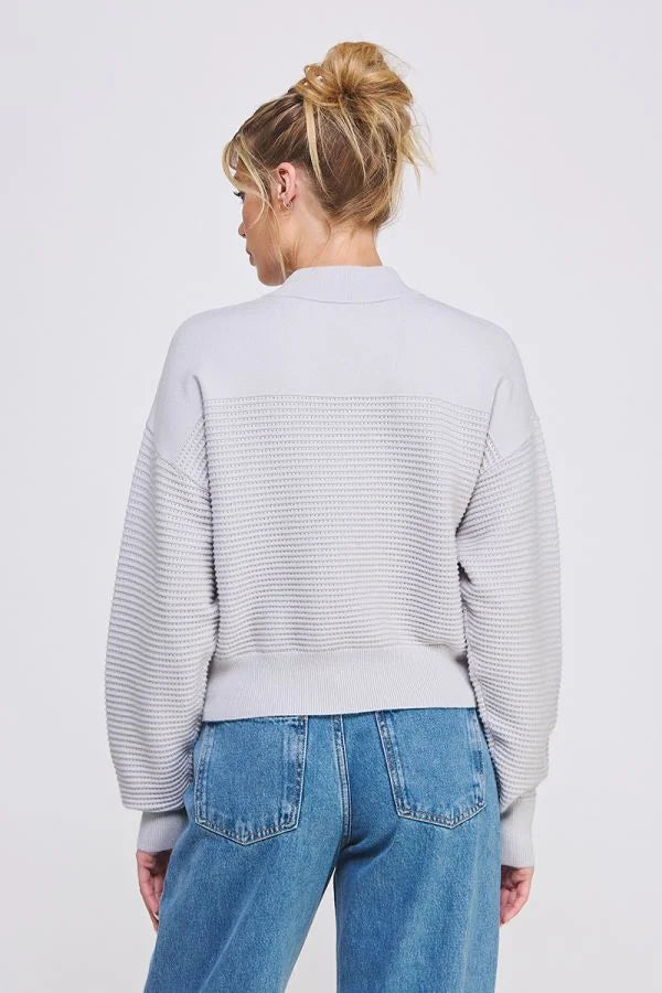 Light gray fine gauge dolman half zip sweater paired with blue jeans, featuring ribbing