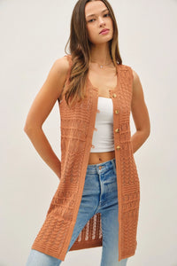 Crochet knit long sleeveless button-up vest from Shop Daisy for women’s boho chic clothing
