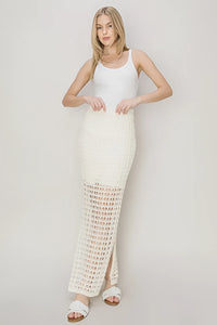Long white sleeveless dress with crochet-style maxi skirt for a boho free spirit style