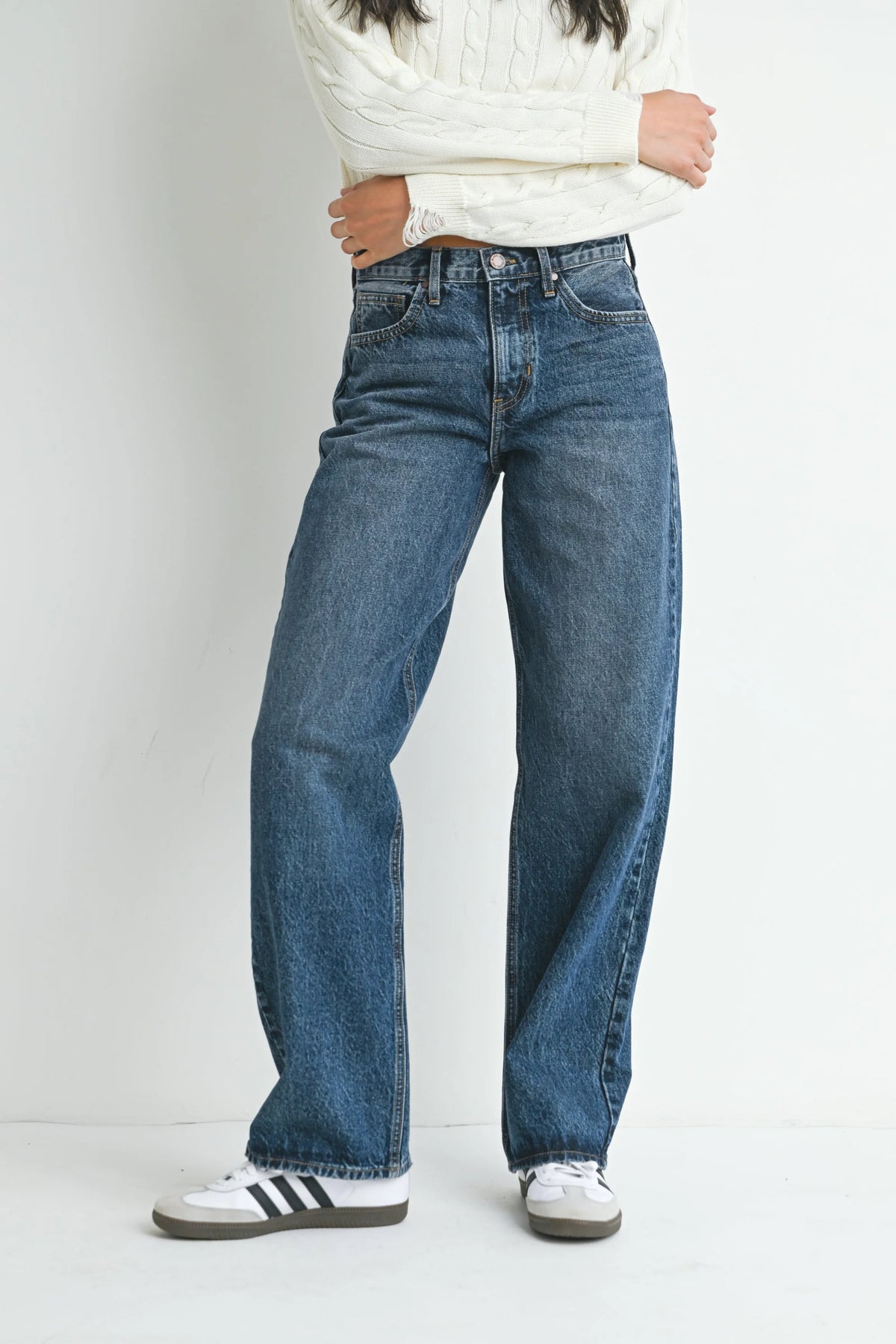 Loose-fitting medium-wash blue denim jeans featuring straight leg design from Shop Daisy
