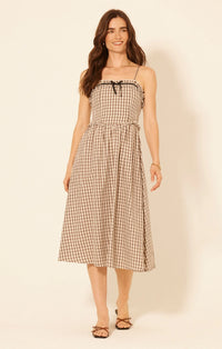 Aspen Plaid Midi Dress featuring gingham pattern, ruffled trim, and black bow detail