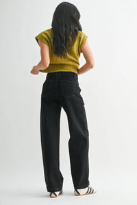 Mustard yellow ribbed knit top with slim wide leg denim pants and striped sneakers
