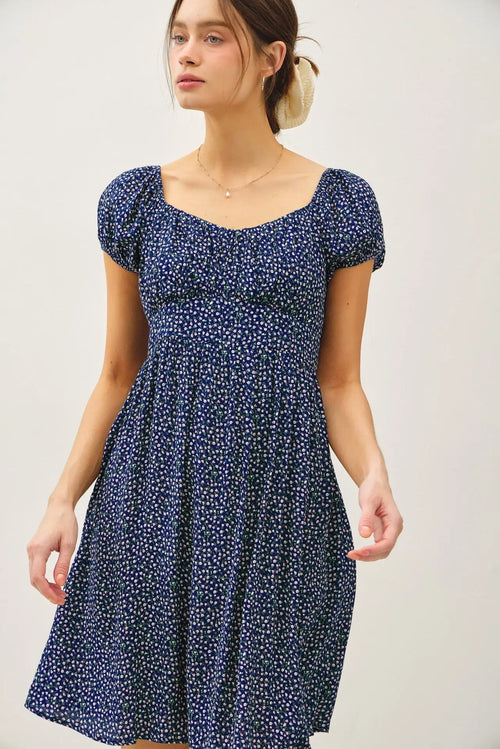 Navy blue floral print mini dress with puff sleeves, ideal in womenās boho chic clothing