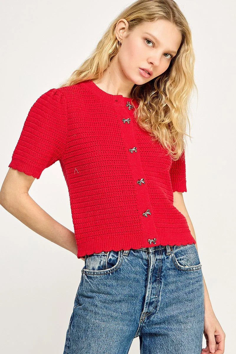 Red short-sleeved button-down cardigan from Shop Daisy, perfect for women’s boho chic clothing