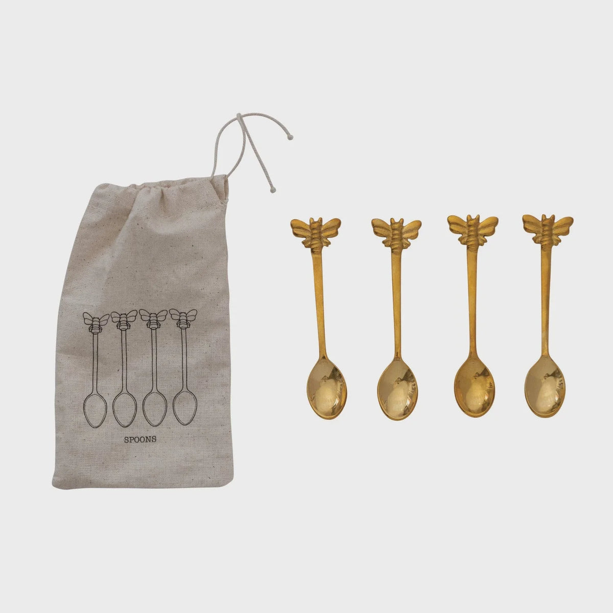 Gold-colored brass spoons with bee design in a printed drawstring bag for elegant storage