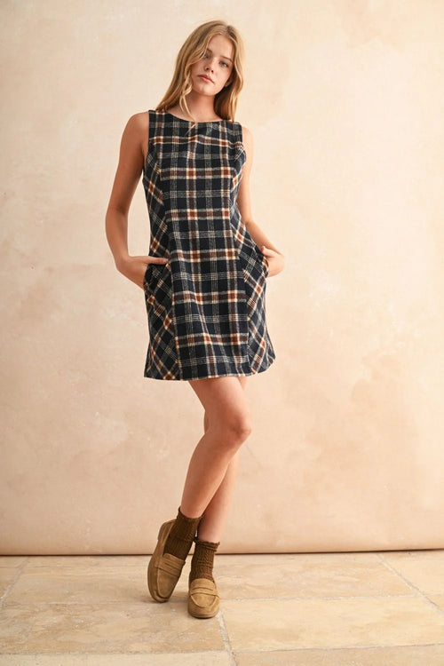 Sleeveless plaid pattern mini dress with side pockets, ideal for casual fashion