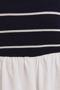 Striped navy and white fabric with gathered white material on woven shorts mix romper