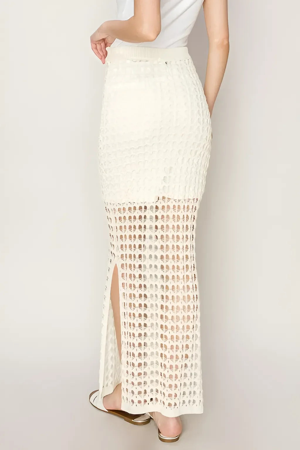 White crochet maxi skirt with side slit and lattice pattern for a boho, free spirit look